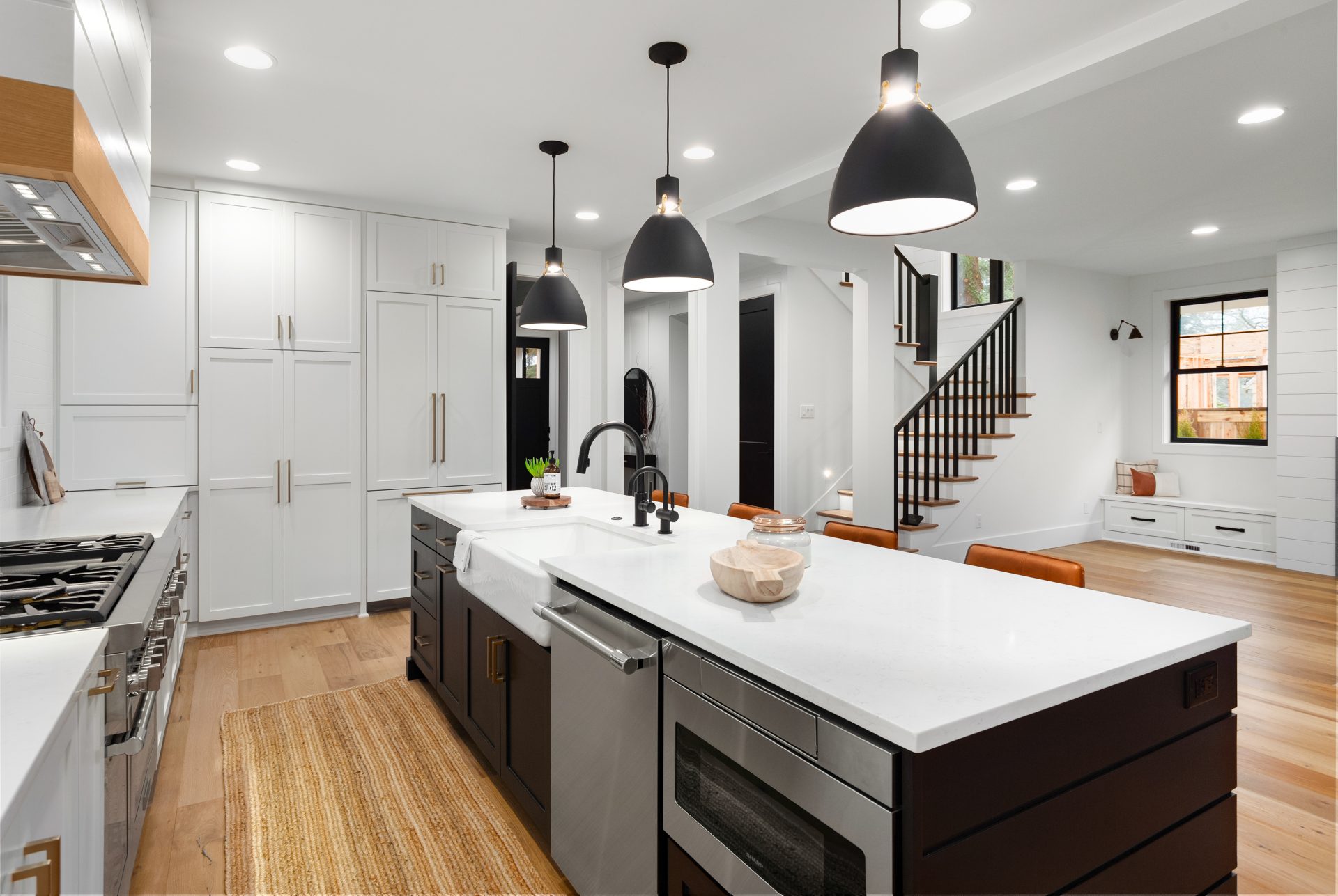 complete home remodeling bay area Beautiful white kitchen with dark accents in new modern farmhouse style luxury home