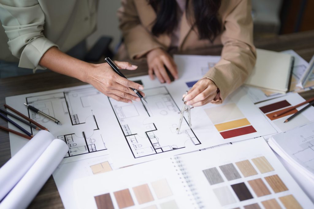Interior designers selecting materials and finalizing 3D plans for a home remodel in Campbell, California