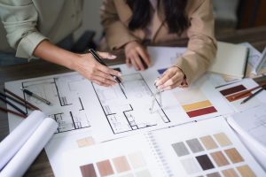 Interior designers selecting materials and finalizing 3D plans for a home remodel in Campbell, California